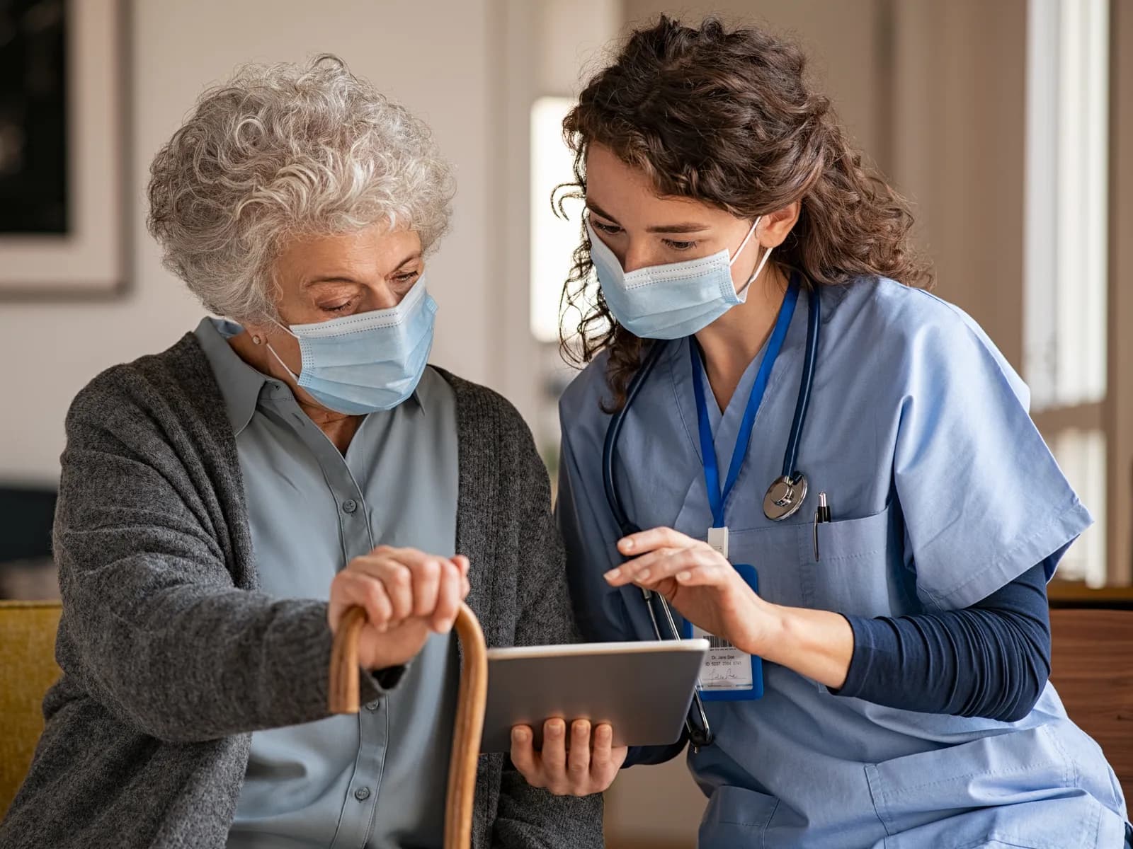 Support worker speaking with an older person in their home